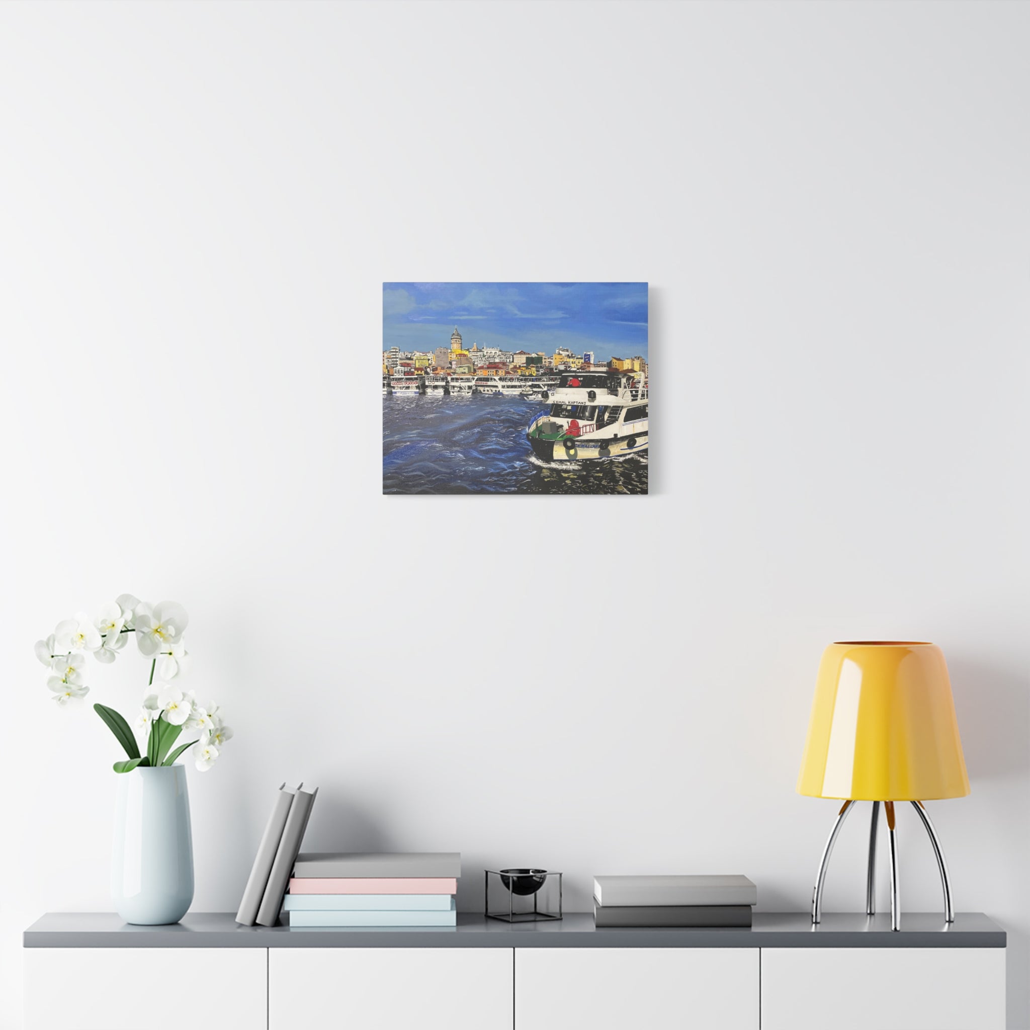 Poster of Porto on a wall above a table with decor items
