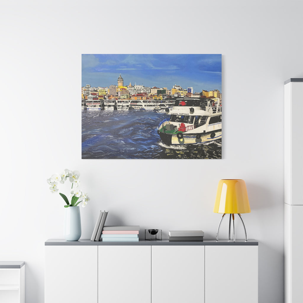Cityscape painting on a wall above a white cabinet with decorative items.