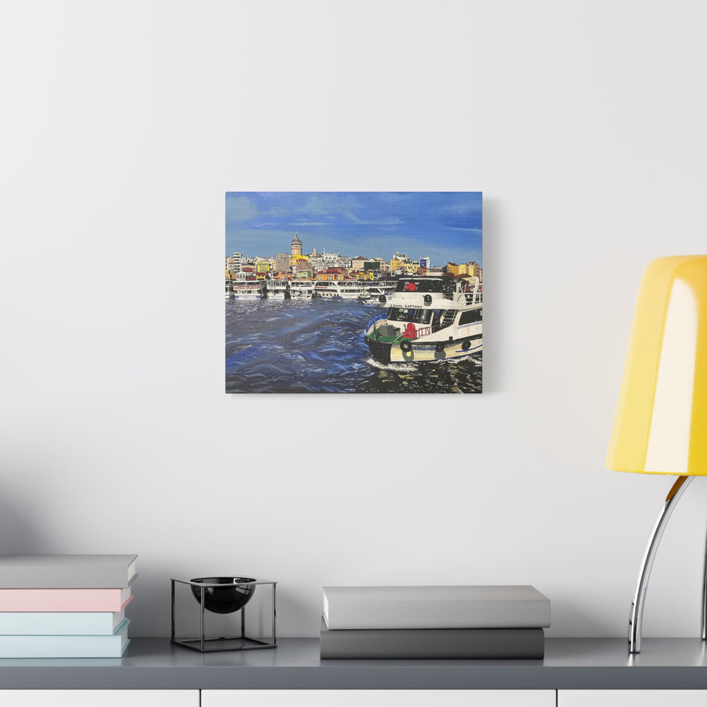 Canvas print of a harbor scene with boats hanging on a wall above a desk.