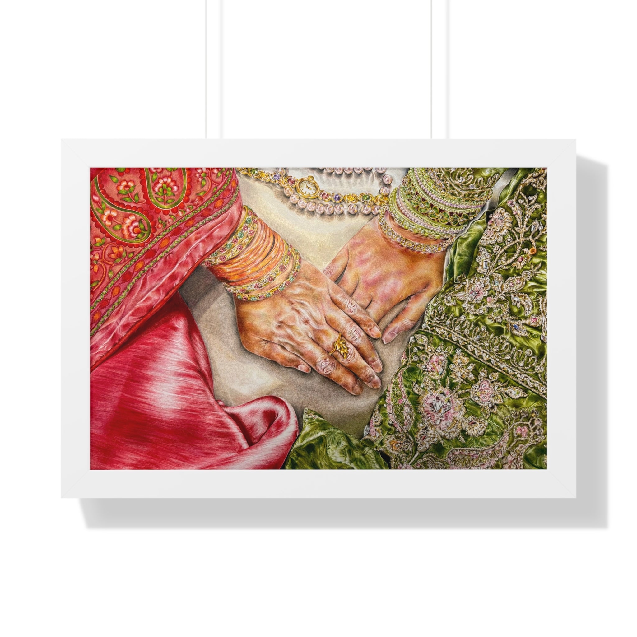 Framed artwork of two hands holding each other, surrounded by intricate patterns and jewelry.